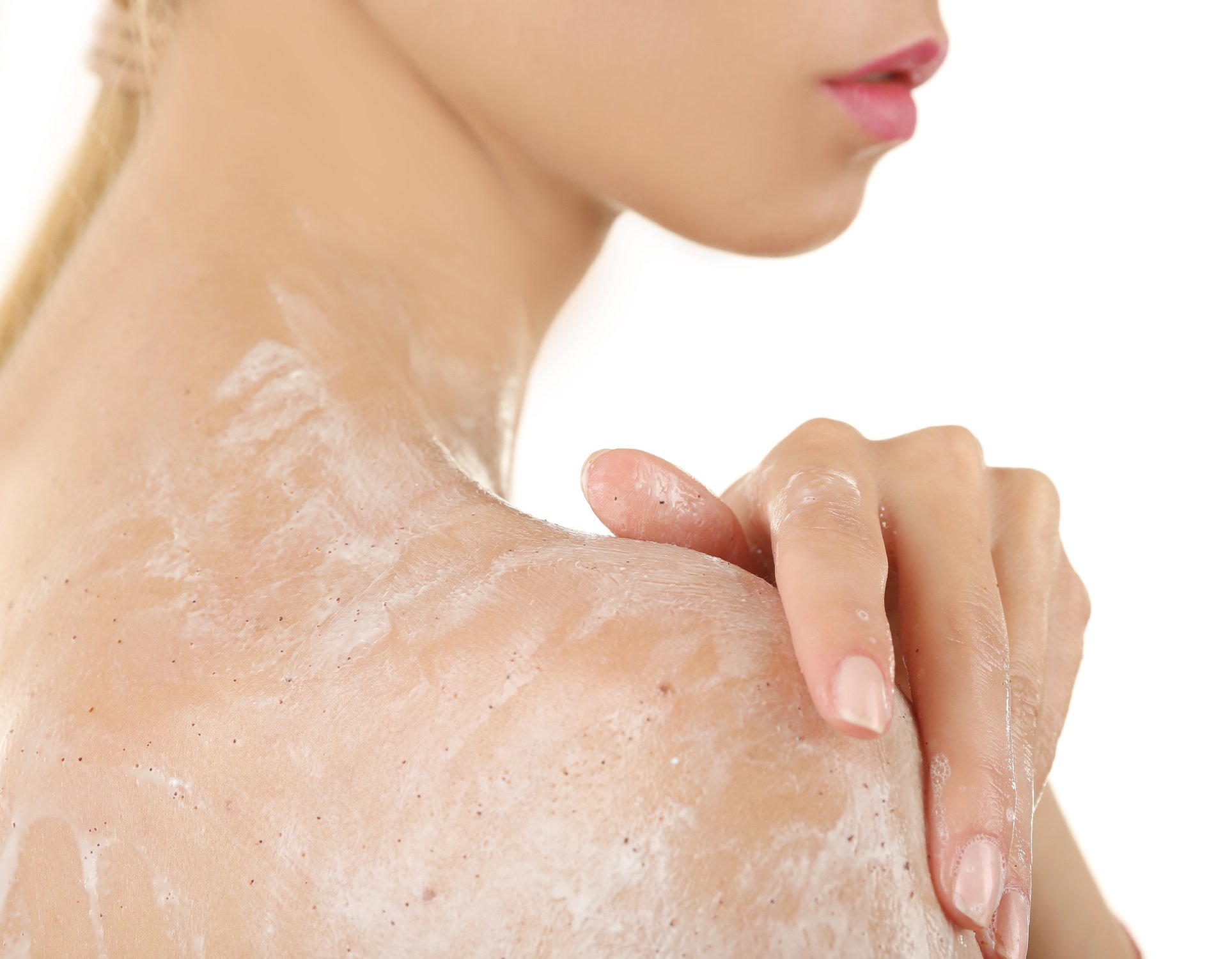 Woman Using Body Scrub on White Background